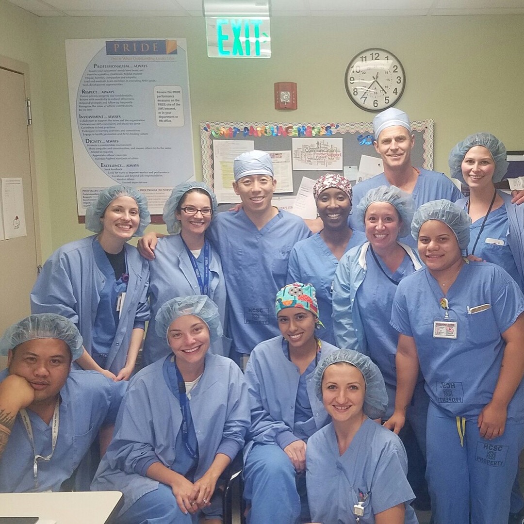 Ken Montgomery, MD and Chihao Tsui, PA-C with their surgical team in scrubs